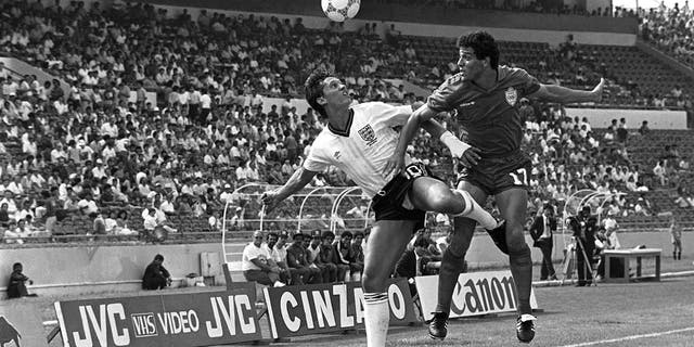 Gary Lineker of England, left, and Morocco's Khairi Abderrazak tussle for the ball, during the World Cup Group F football match in Monterrey, Mexico, on June 6, 1986.