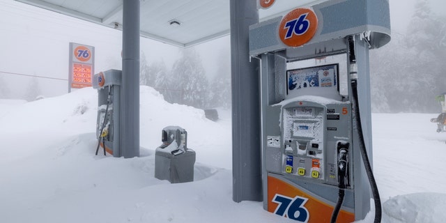 With no customers in sight, a gas station is one of the few businesses that remains open in the mountains though gas supplies are becoming limited as residents throughout the San Bernardino Mountains continue to be trapped in their homes by snow on March 1, 2023, in Running Springs, California. 