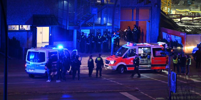 Armed police officers near the scene of a shooting in Hamburg, Germany on Thursday March 9, 2023, after one or more people opened fire in a church. 