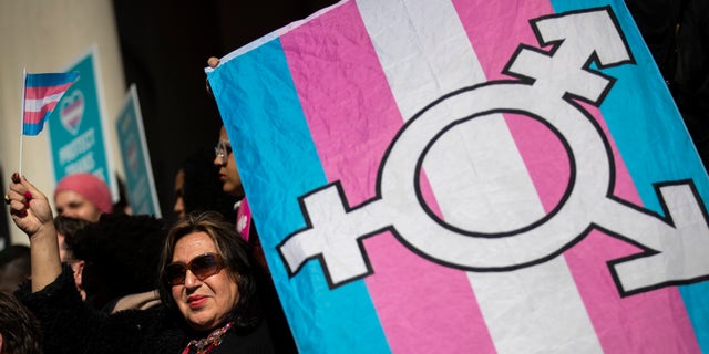 LGBT activists and their supporters rally in support of transgender people on the steps of New York City Hall, Oct. 24, 2018 in New York City.