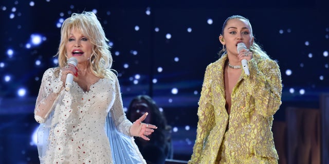 Dolly Parton (L) and Miley Cyrus perform onstage during the 61st Annual GRAMMY Awards at Staples Center on February 10, 2019 in Los Angeles, California.