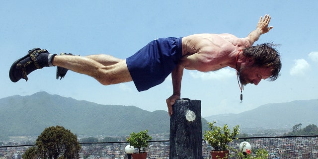 Wim Hof, known as the "Iceman" for his ability to withstand seemingly impossible levels of cold, demonstrates at a hotel in Kathmandu in May 2007.  