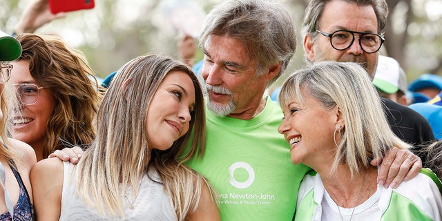 Olivia Newton-John attended the Walk for Wellness event in 2019 with daughter Chloe Lattanzi and husband John Easterling.
