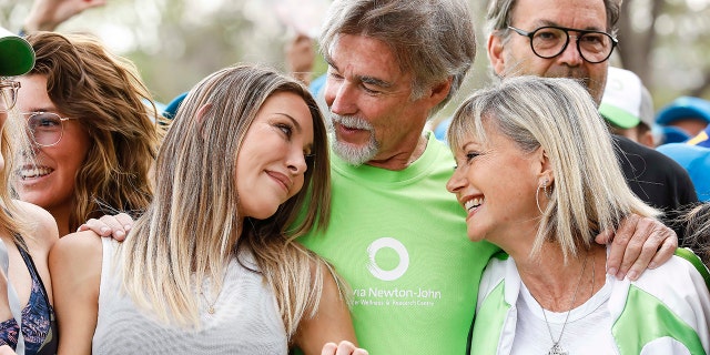 Olivia Newton-John attended the Walk for Wellness event in 2019 with daughter Chloe Lattanzi and husband John Easterling.