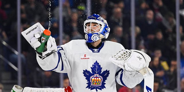 Toronto Marlies goalie Kasimir Kaskisuo (30) throws water into the air during the Toronto Marlies' game against the Laval Rocket on December 28, 2019, at Place Bell in Laval, QC.