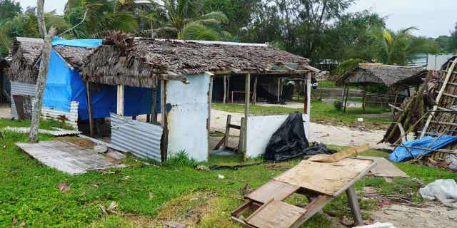 Damaged buildings are pictured near Vanuatu's capital on April 7, 2020, after Tropical Cyclone Harold hit the island. Another cyclone hit Vanuatu on March 1, 2023, causing trees to be knocked over and flooding.