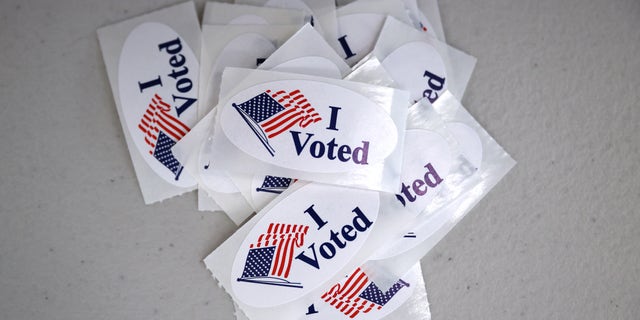 "I voted" stickers are stacked at a polling place in the Robert Miller Community Center.