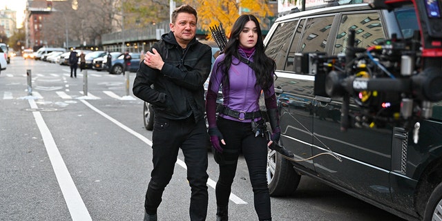 Jeremy Renner and Hailee Steinfeld seen on the set of 'Hawkeye' on the Lower East Side on December 8, 2020, in New York City. 