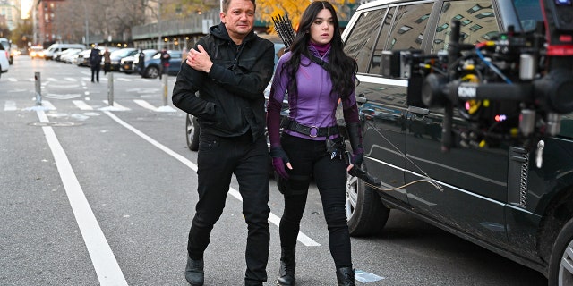 Jeremy Renner and Hailee Steinfeld seen on the set of 'Hawkeye' on the Lower East Side on December 8, 2020, in New York City.