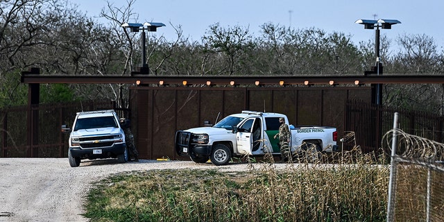 U.S. Border Patrol patrols the bank of the Rio Grande near the Gateway International Bridge, between the cities of Brownsville, Texas, and Matamoros, Tamaulipas, Mexico, March 16, 2021, in Brownsville, Texas.