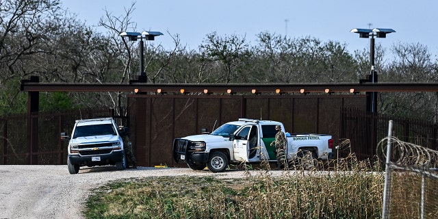 US border Police patrol on the bank of the Rio Grande near the Gateway International Bridge, between the cities of Brownsville, Texas, and Matamoros, Tamaulipas, Mexico on March 16, 2021, in Brownsville, Texas.