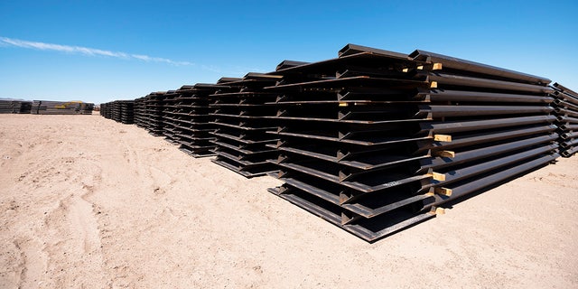 Piles of unused border fence sit at one of the border wall construction staging areas on the Johnson Ranch near Columbus, N.M., on April 12, 2021.