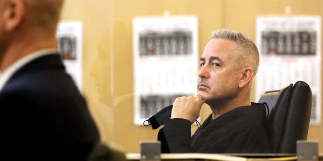 Judge Daniel Lowenthal, right, listens during a hearing at Governor George Deukmejian Courthouse in Long Beach, California, on Jan. 19, 2022.