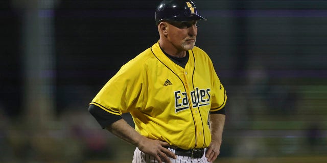 Southern Miss head coach Scott Berry coaches at third base during a college baseball game between the Southern Miss Golden Eagles and the Mississippi State Bulldogs on March 2, 2022, at Trustmark Park, Pearl, Mississippi.