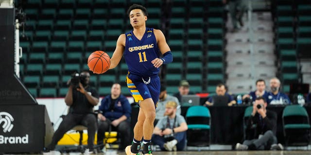 Quinnipiac Bobcats Guard Dezi Jones (11) dribbles the ball up the court during the first half of a MAAC Conference tournament quarterfinal game against the St. Peters Peacocks March 11, 2022, at Boardwalk Hall in Atlantic City, N.J.