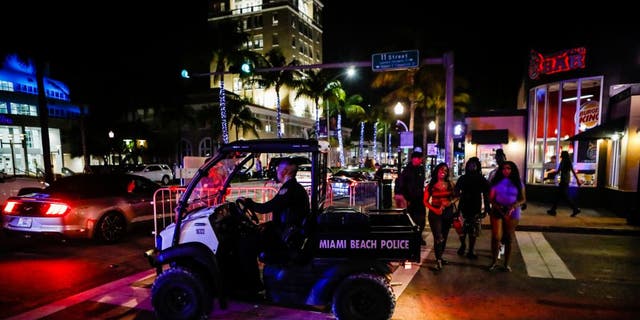 A Miami Beach Police officer exits a closed road during Spring Break in Miami Beach, Florida, on March 24, 2022. 