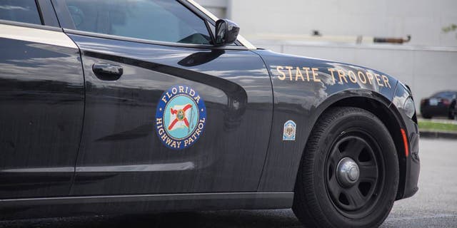 A Florida Highway Patrol vehicle is seen sitting on the side of a road.