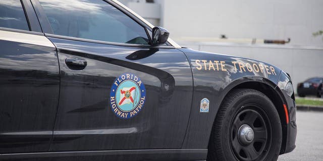 Florida bill aimed at creating harsher penalties for slow left-lane drivers: 'Supposed to move over' 4 A Florida Highway Patrol vehicle is seen sitting on the side of a road.