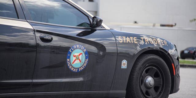 A Florida Highway Patrol vehicle is seen sitting on the side of a road.