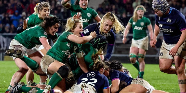 Ireland players celebrate as Enya Breen scores her side's second try during the Tik Tok Women's Six Nations Rugby Championship match between Ireland and Scotland at Kingspan Stadium in Belfast.