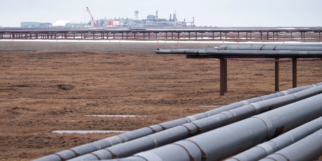 Oil pipelines stretch across the landscape outside Nuiqsut, Alaska, where ConocoPhillips operates the Alpine Field on May 28, 2019.