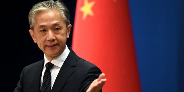 Chinese Foreign Ministry spokesman Wang Wenbin gestures during a press conference at the Ministry of Foreign Affairs in Beijing.