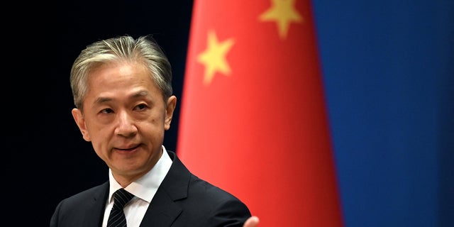 Chinese Foreign Ministry spokesman Wang Wenbin gestures during a press conference at the Ministry of Foreign Affairs in Beijing on August 8, 2022.