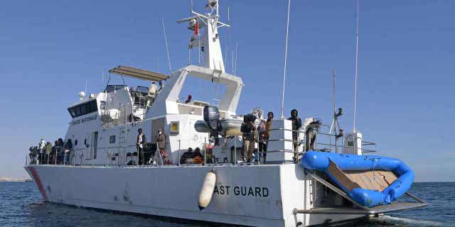 Migrants from sub-Saharan Africa are rescued by the Tunisian Coast Guard off the coast of central Tunisian on Oct. 4, 2022. The Tunisian Coast Guard recovered 54 bodies from a sinking boat of the countries coast on Wednesday night, 14 others were killed in the accident.