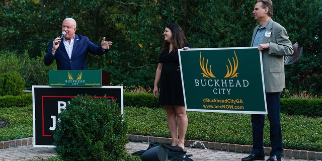 Buckhead City Committee CEO Bill White unveils new Buckhead City signage at an event for GOP then-candidate for Lt. Gov. Burt Jones in October. Two bills supporting the proposal cleared a state Senate panel earlier this week.