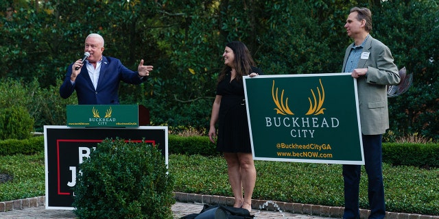 Buckhead City Committee CEO Bill White unveils new Buckhead City signage at an event for GOP then-candidate for Lt. Gov. Burt Jones in October. Two bills supporting the proposal cleared a state Senate panel earlier this week.