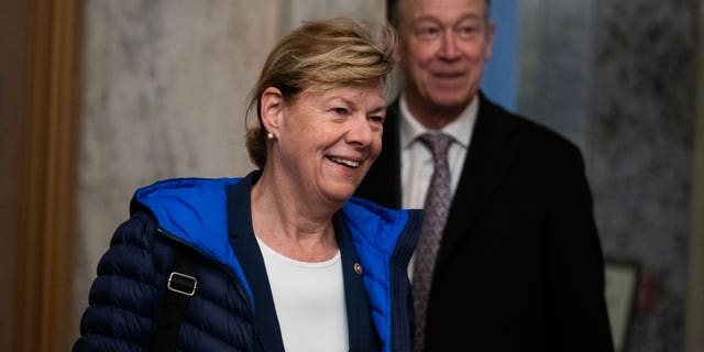 Senators Tammy Baldwin, D-Wisc., and John Hickenlooper, D-Colo., arrive to the U.S. Capitol Nov. 16, 2022.