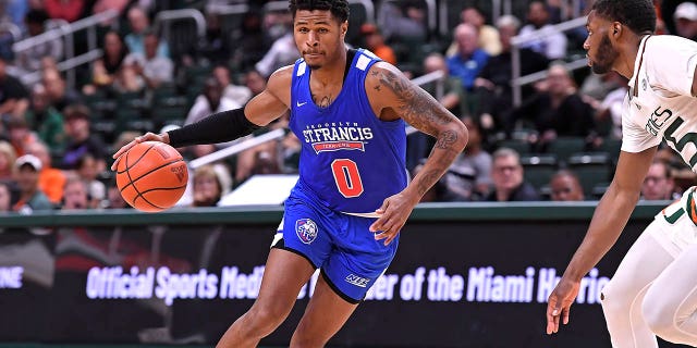 St. Francis guard Tedrick Wilcox Jr. drives against the Miami Hurricanes on November 23, 2022 at the Watsco Center in Coral Gables, Florida.