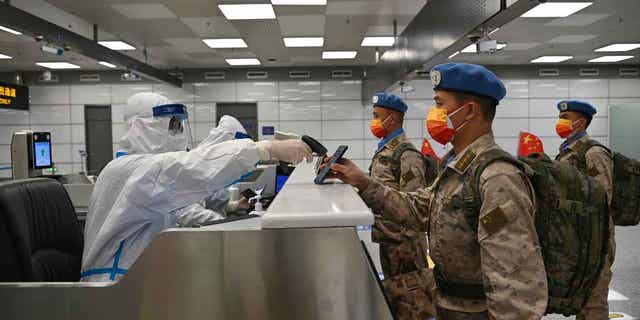 Chinese peacekeepers who will be stationed in Juba, South Sudan on a United Nations peacekeeping mission are pictured at an airport in Zhengzhou, China December 6, 2022. The UN peacekeepers have condemned South Sudan for sending troops to the Abyei region.