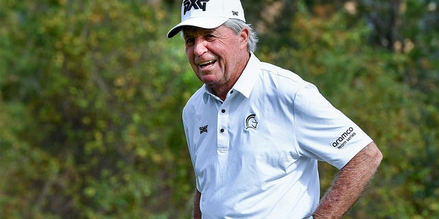 Gary Player laughs as he arrives at the 10th hole during the 2022 PNC Championship at The Ritz-Carlton Golf Club in Orlando.
