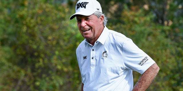 Gary Player laughs as he arrives at the 10th hole during the 2022 PNC Championship at The Ritz-Carlton Golf Club in Orlando.