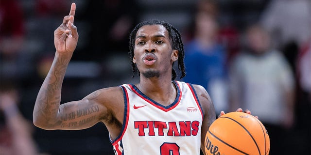 Detroit Mercy Titans No. 0 Antoine Davis brings the ball up court during a game against the Cincinnati Bearcats at Fifth Third Arena on December 21, 2022 in Cincinnati.