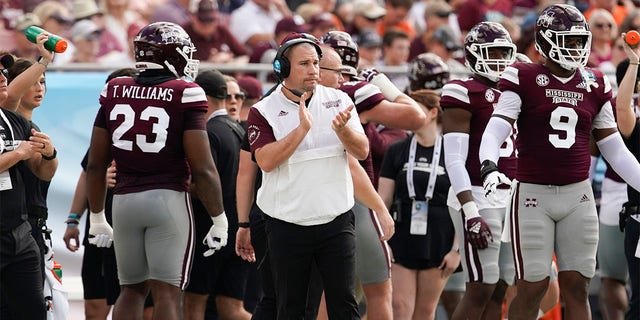 Mississippi State Bulldogs head coach Zach Arnett cheers on his team during the ReliaQuest Bowl college football game against the Illinois Fighting Illini at Raymond James Stadium in Tampa, Florida on January 2, 2023.