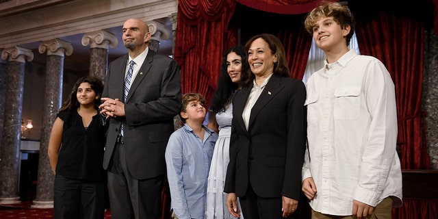 US Democratic Senator from Pennsylvania John Fetterman, Fetterman's wife Gisele Barreto Fetterman, and his family pose for a picture with Vice President Kamala Harris in the Old Senate Chamber at the US Capitol in Washington, DC, January 3, 2023. 