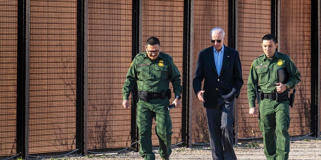 President Joe Biden speaks with Customs and Border Protection officers as he visits the U.S.-Mexico border in El Paso, Texas.