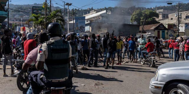 Armed police officers protest after a gang attack on a police station that left six officers dead in Port-au-Prince, Haiti, Jan. 26, 2023.