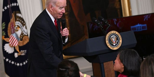President Biden shakes hands with Ambassador Katherine Tai, U.S. trade representative, as he speaks during a reception to celebrate the Lunar New Year in the East Room of the White House in Washington, D.C., on Jan. 26, 2023.