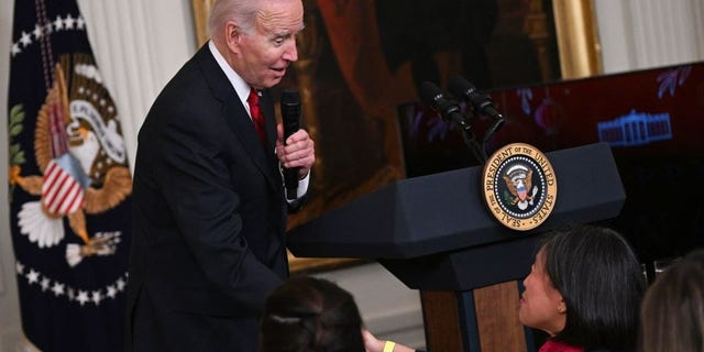 President Biden shakes hands with Ambassador Katherine Tai, U.S. trade representative, as he speaks during a reception to celebrate the Lunar New Year in the East Room of the White House in Washington, D.C., on Jan. 26, 2023.