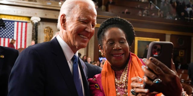 President Joe Biden takes a selfie with Rep. Sheila Jackson Lee (D-TX) after delivering the State of the Union address on February 7, 2023, in the House Chamber of the U.S. Capitol in Washington, DC.