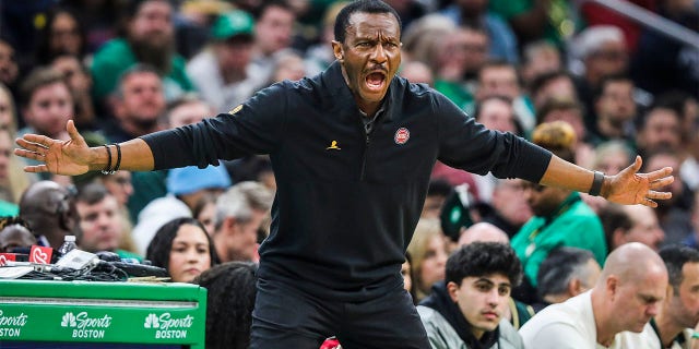 Detroit Pistons head coach Dwane Casey puts himself in a defensive position on the sidelines.  The Boston Celtics defeated the Pistons, 127-109. 