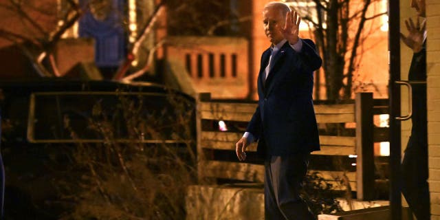 President Joe Biden waves to reporters as he departs following dinner at the Red Hen restaurant in Washington, D.C., on Feb. 18, 2023.
