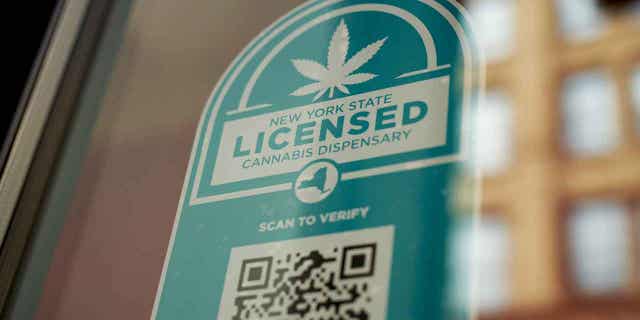 A New York State licensed cannabis dispensary sign is shown at Union Square Travel Agency in New York, on Feb. 16, 2023. A New York appeals court ruling will make it easier for officials in some parts of the state to issue licenses for recreational marijuana dispensaries.