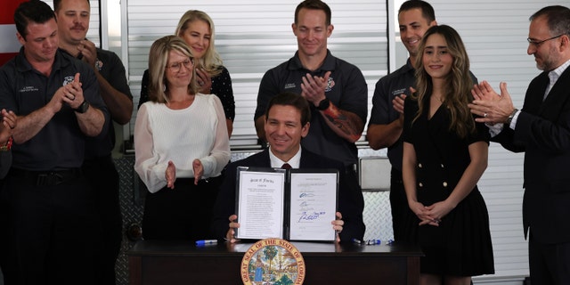 Gov. Ron DeSantis signs a law on Monday, Feb. 27, 2023, that gives the state control of Disney World's Reedy Creek Improvement District, stripping the resort of its self-governing powers.