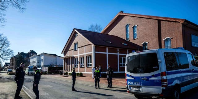 Police cordon off a street near the building of the New Life community in Bramsche, Germany, Feb. 28, 2023. According to initial police reports, two people have been critically injured by gunshots near an elementary school in Bramsche.