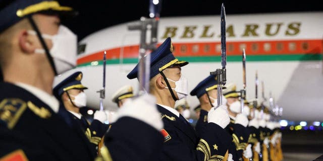 Chinese honor guards stand at attention during a welcoming ceremony for Belarusian President Alexander Lukashenko at Beijing's airport February 28, 2023.