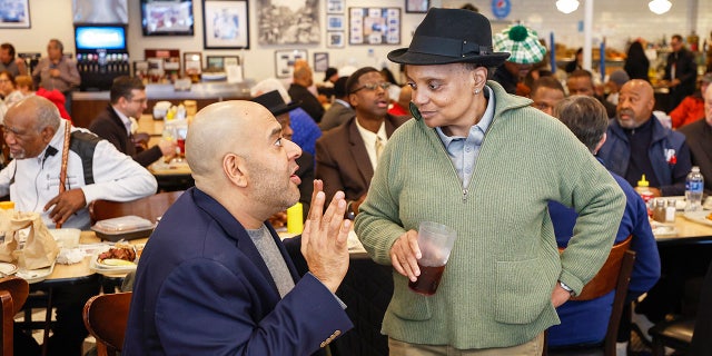 Chicago Mayor Lori Lightfoot chats with a supporter after eating lunch at Manny's Cafeteria and Delicatessen on Feb. 28, 2023.